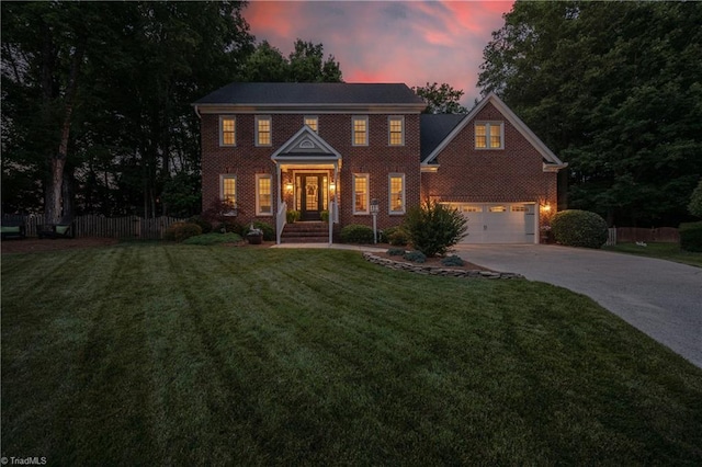 4919 Setter Ct, Jamestown, NC 27282 - colonial-style house with driveway, brick siding, and a garage