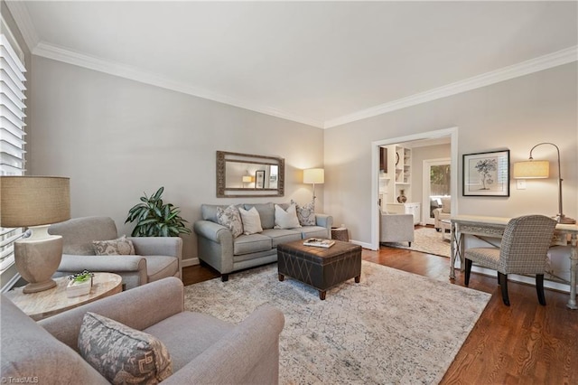 4919 Setter Ct, Jamestown, NC 27282 - living area with ornamental molding, wood finished floors, baseboards, and plenty of natural light