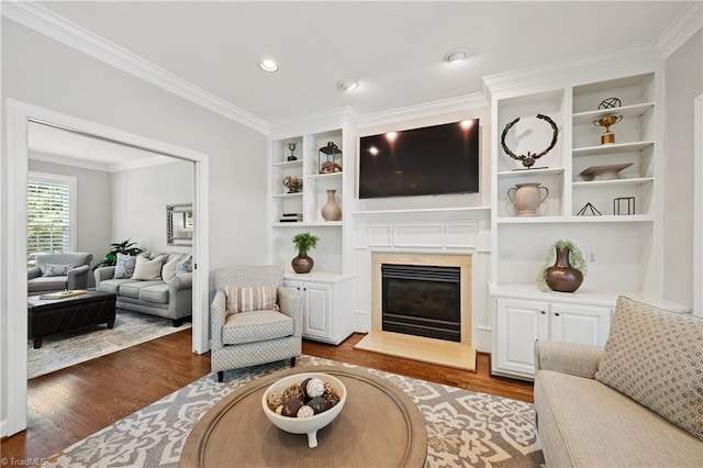 4919 Setter Ct, Jamestown, NC 27282 - living area with wood finished floors, ornamental molding, a fireplace, built in features, and recessed lighting