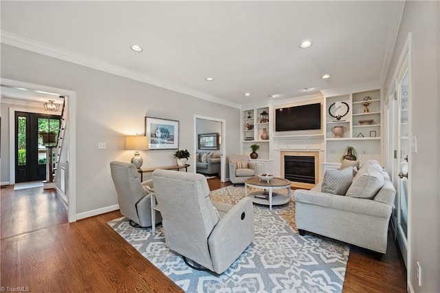 4919 Setter Ct, Jamestown, NC 27282 - living room with recessed lighting, ornamental molding, a glass covered fireplace, wood finished floors, and baseboards