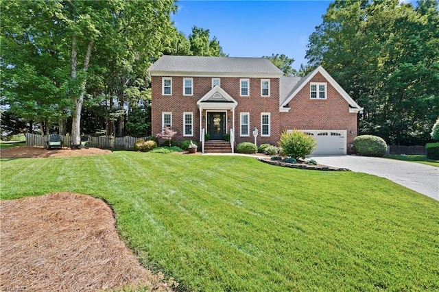 4919 Setter Ct, Jamestown, NC 27282 - colonial house featuring driveway, brick siding, and a garage
