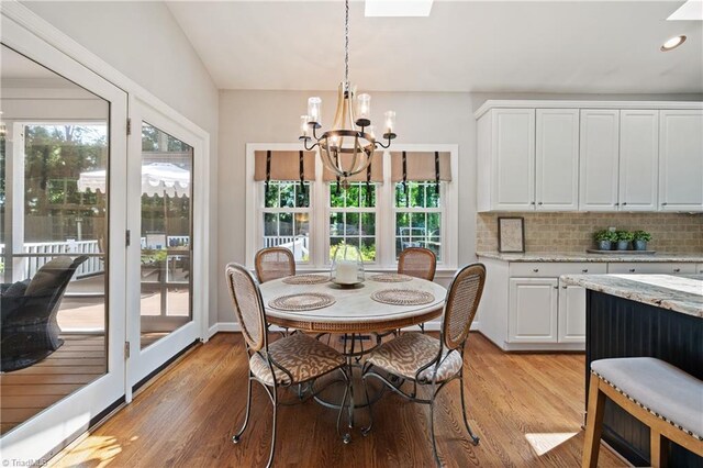 4919 Setter Ct, Jamestown, NC 27282 - dining room with a chandelier, light wood-style floors, healthy amount of natural light, and recessed lighting