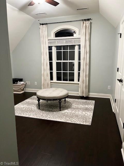 sitting room with wood-type flooring, vaulted ceiling, and ceiling fan