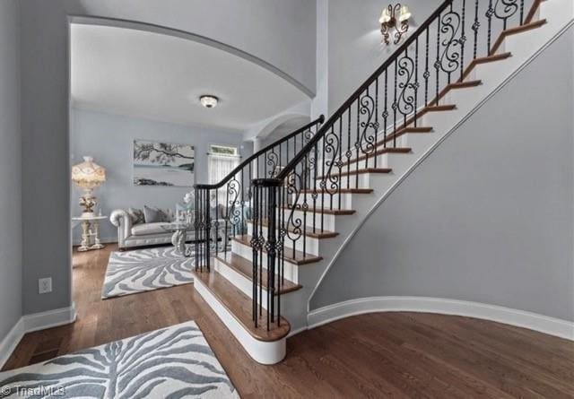 staircase featuring hardwood / wood-style flooring