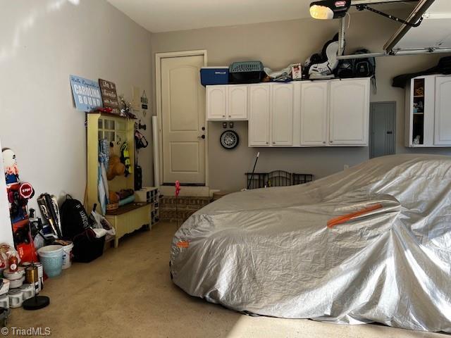 carpeted bedroom featuring electric panel