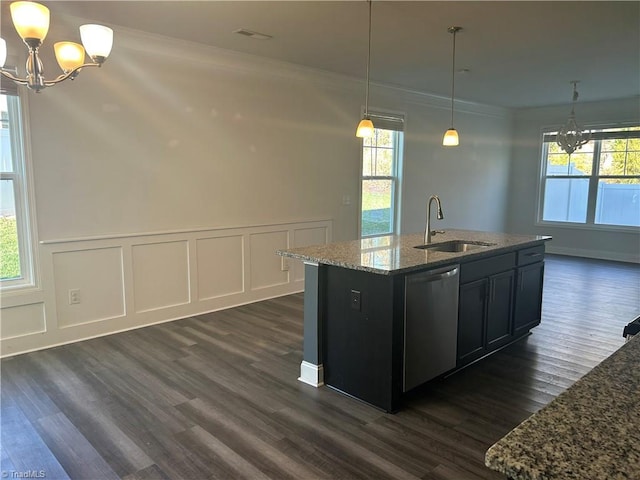 kitchen featuring an inviting chandelier, a sink, dishwasher, crown molding, and a wealth of natural light