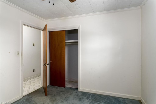 unfurnished bedroom with crown molding, carpet floors, and ceiling fan