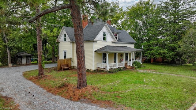 view of front of house featuring a front yard and a porch