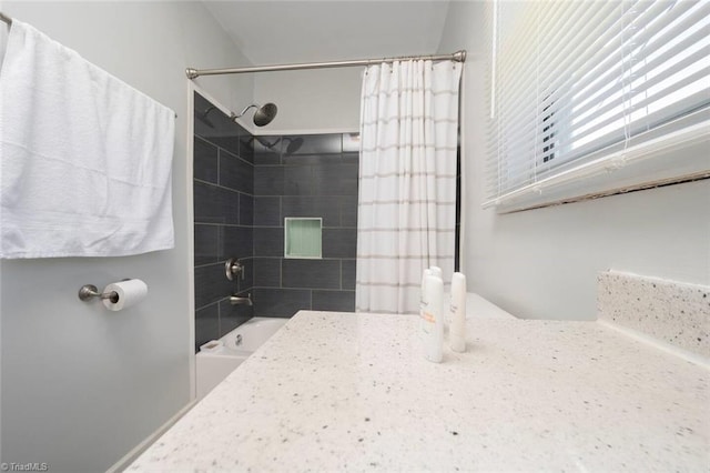 bathroom featuring shower / bathtub combination with curtain