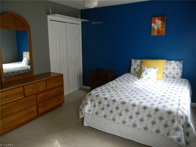 carpeted bedroom with a closet