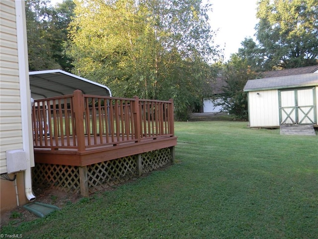 view of yard featuring a storage shed and a deck