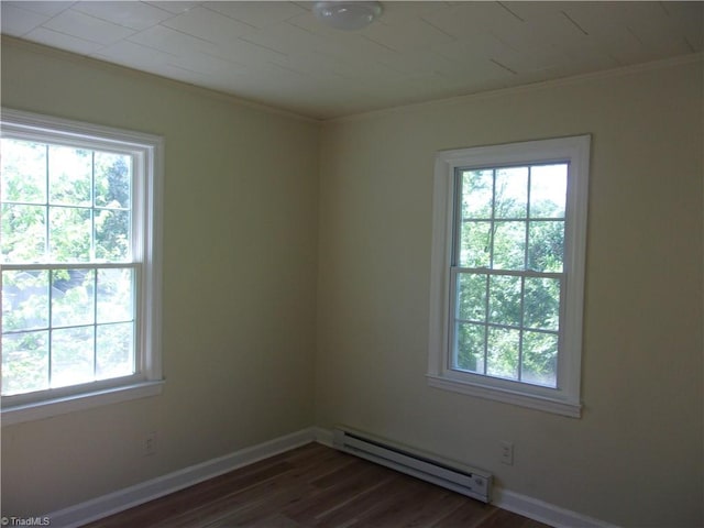 spare room featuring plenty of natural light and baseboard heating