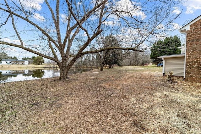 view of yard with a water view