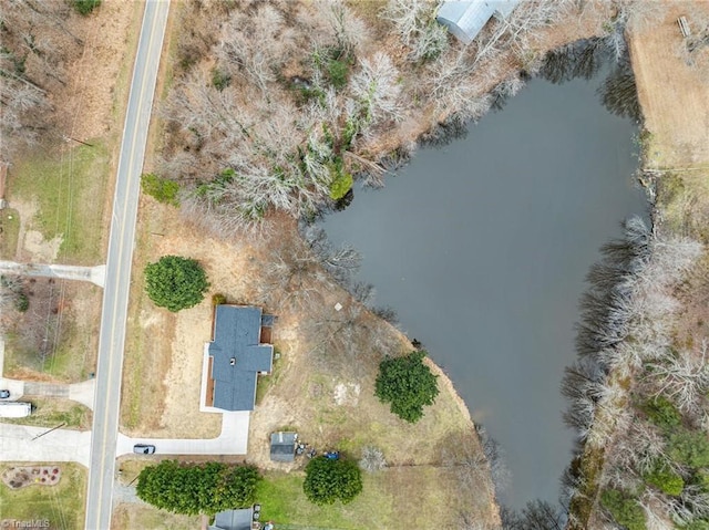 birds eye view of property featuring a water view