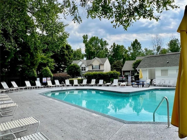 88 Tannenbaum Cir, Greensboro, NC 27410 - community pool with a patio and fence