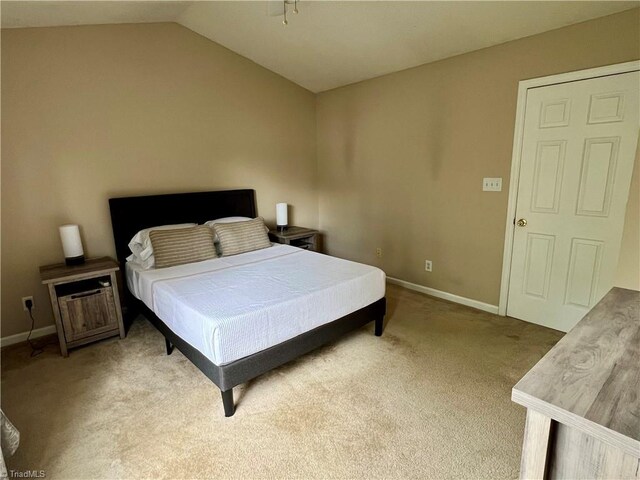 88 Tannenbaum Cir, Greensboro, NC 27410 - bedroom featuring baseboards, carpet, and vaulted ceiling