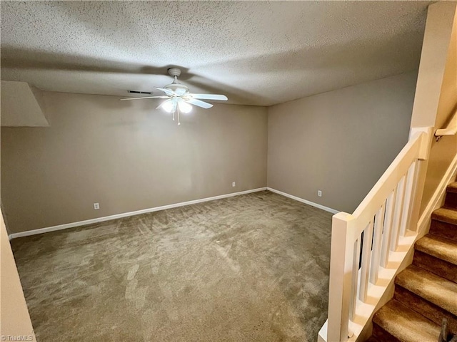 88 Tannenbaum Cir, Greensboro, NC 27410 - carpeted empty room with a ceiling fan, a textured ceiling, stairs, and baseboards