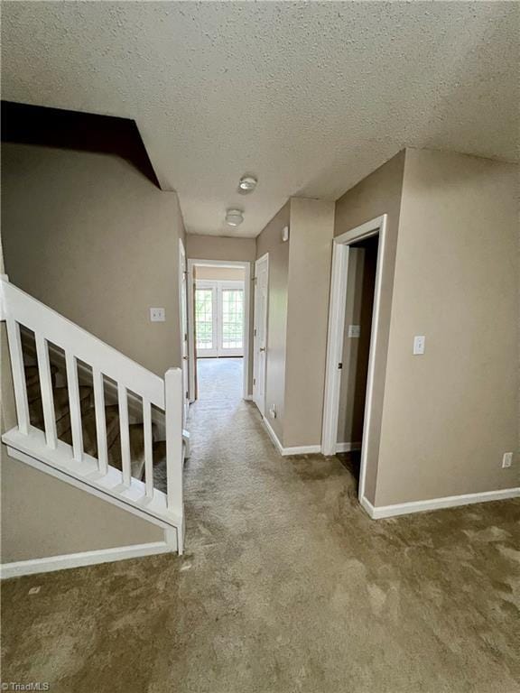 88 Tannenbaum Cir, Greensboro, NC 27410 - corridor with carpet floors, a textured ceiling, and baseboards