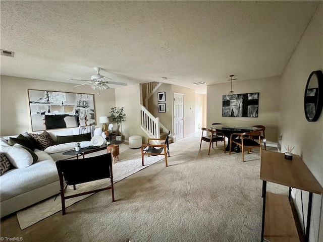 88 Tannenbaum Cir, Greensboro, NC 27410 - living room with stairway, carpet, a ceiling fan, a textured ceiling, and baseboards