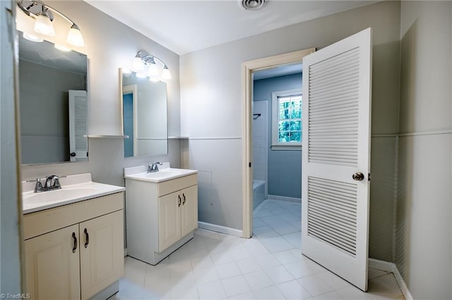3230 Kinnamon Rd, Winston-Salem, NC 27104 - bathroom featuring baseboards, shower / tub combination, two vanities, and a sink
