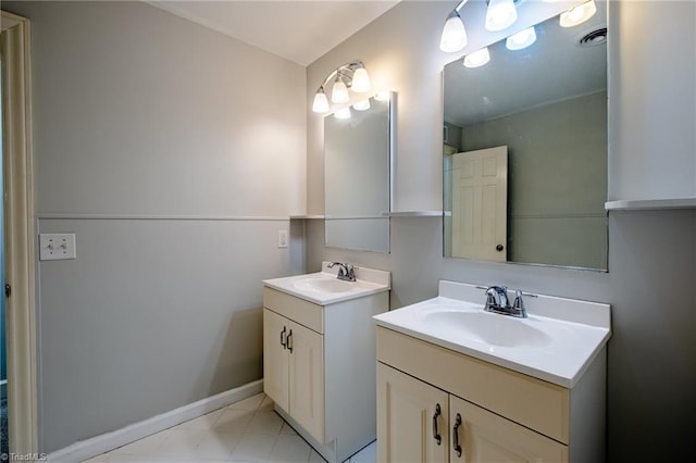 3230 Kinnamon Rd, Winston-Salem, NC 27104 - bathroom featuring baseboards, two vanities, and a sink