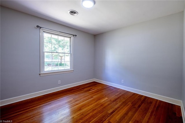 3230 Kinnamon Rd, Winston-Salem, NC 27104 - unfurnished room with baseboards, dark wood finished floors, and visible vents