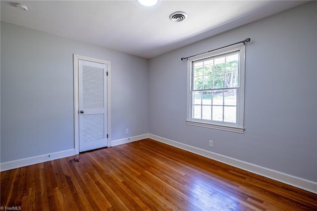3230 Kinnamon Rd, Winston-Salem, NC 27104 - empty room featuring baseboards, visible vents, and wood finished floors