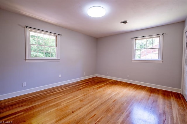 3230 Kinnamon Rd, Winston-Salem, NC 27104 - empty room with baseboards, light wood finished floors, and visible vents