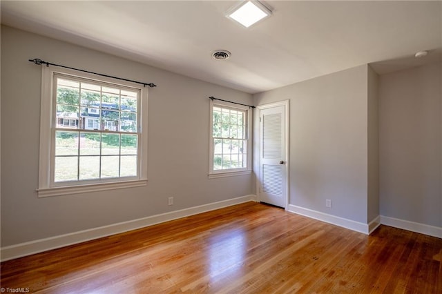 3230 Kinnamon Rd, Winston-Salem, NC 27104 - spare room with light wood-style floors, baseboards, and a healthy amount of sunlight