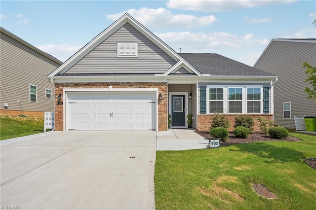 162 Bryson Blvd, Lexington, NC 27295 - view of front facade featuring brick siding, a front yard, concrete driveway, and an attached garage