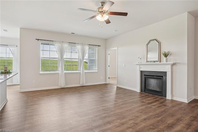 162 Bryson Blvd, Lexington, NC 27295 - unfurnished living room with wood finished floors, ceiling fan, plenty of natural light, and a glass covered fireplace