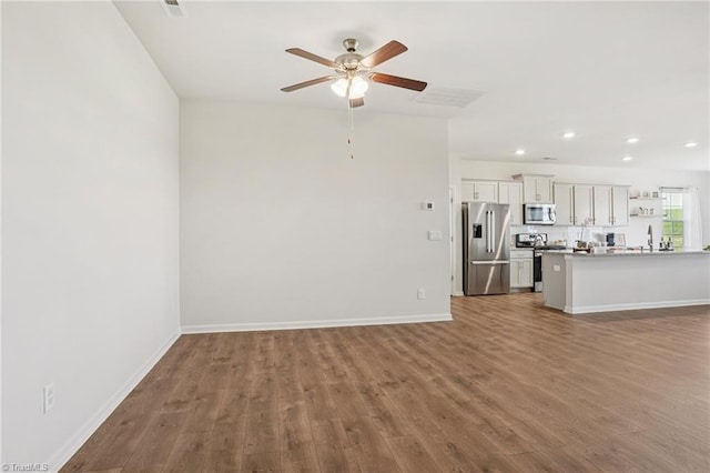 162 Bryson Blvd, Lexington, NC 27295 - unfurnished living room featuring a ceiling fan, wood finished floors, and recessed lighting