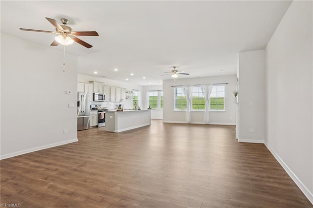 162 Bryson Blvd, Lexington, NC 27295 - unfurnished living room featuring a ceiling fan, dark wood-style floors, and recessed lighting