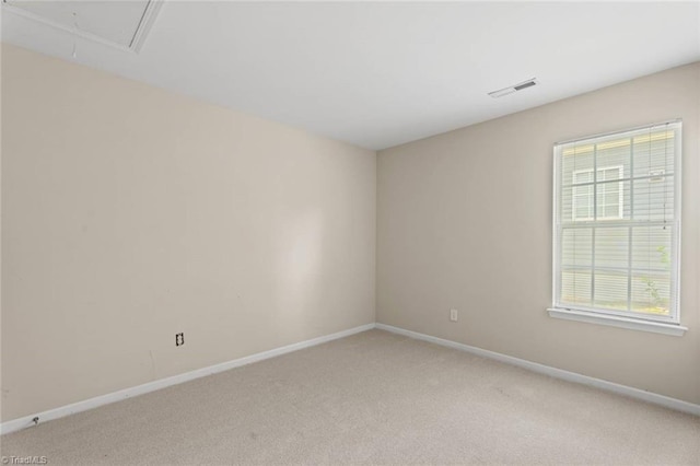 6051 Brookstone Ridge Dr, Winston-Salem, NC 27107 - empty room featuring light colored carpet, baseboards, and attic access