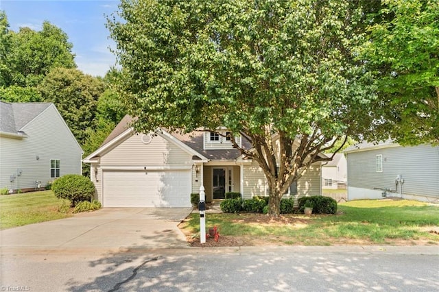 6051 Brookstone Ridge Dr, Winston-Salem, NC 27107 - obstructed view of property featuring driveway, a garage, and a front yard