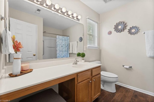 6051 Brookstone Ridge Dr, Winston-Salem, NC 27107 - full bathroom with toilet, vanity, wood finished floors, baseboards, and a shower with shower curtain