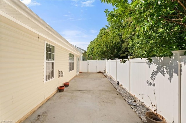 6051 Brookstone Ridge Dr, Winston-Salem, NC 27107 - fenced backyard with a patio area