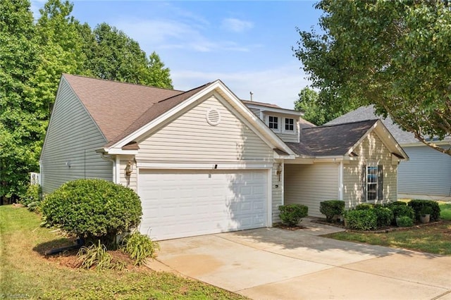 6051 Brookstone Ridge Dr, Winston-Salem, NC 27107 - traditional-style house featuring a garage, concrete driveway, and a shingled roof