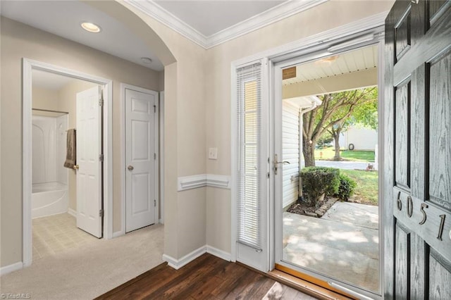 6051 Brookstone Ridge Dr, Winston-Salem, NC 27107 - entrance foyer with crown molding, baseboards, arched walkways, and dark wood-style flooring