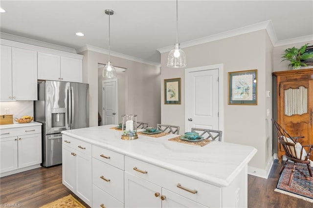 kitchen featuring stainless steel fridge, white cabinets, dark wood-style flooring, and light countertops