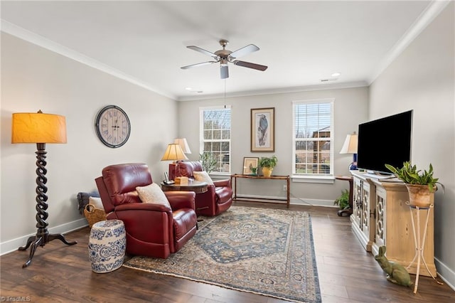 living area with wood-type flooring, a ceiling fan, and ornamental molding