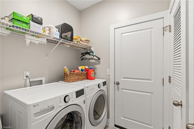 laundry room featuring washer and dryer and laundry area