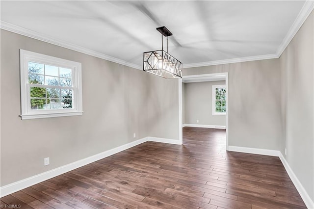 unfurnished room with baseboards, an inviting chandelier, dark wood-style floors, and crown molding