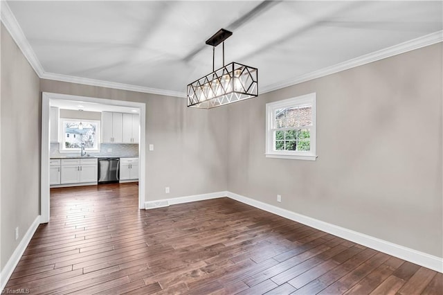 unfurnished dining area with crown molding, baseboards, dark wood-style flooring, and visible vents