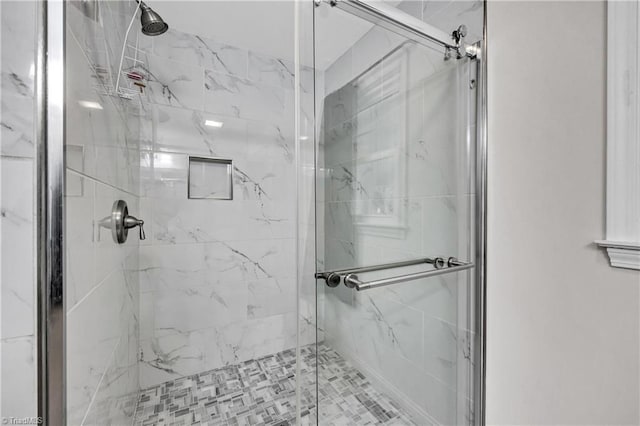 full bathroom featuring a marble finish shower