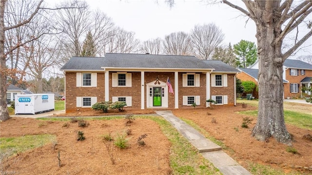 view of front of property with brick siding and driveway