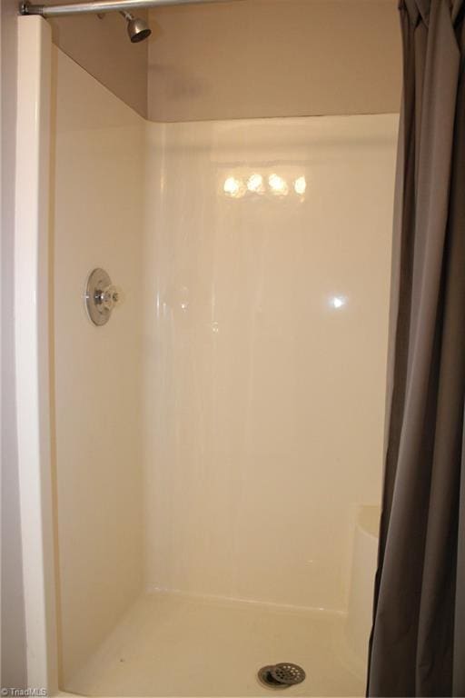 bathroom with curtained shower