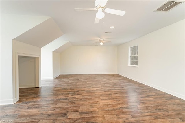 bonus room with visible vents, baseboards, a ceiling fan, and wood finished floors