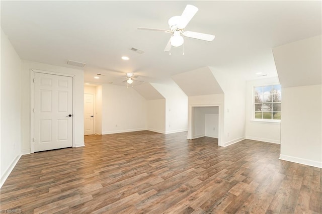 bonus room featuring visible vents, baseboards, ceiling fan, vaulted ceiling, and wood finished floors