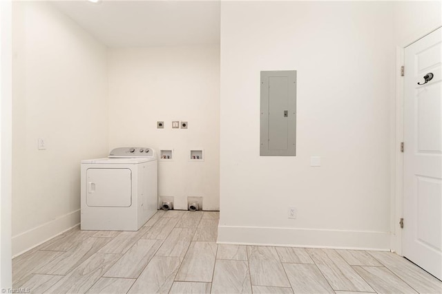 washroom featuring electric panel, laundry area, washer / dryer, and baseboards